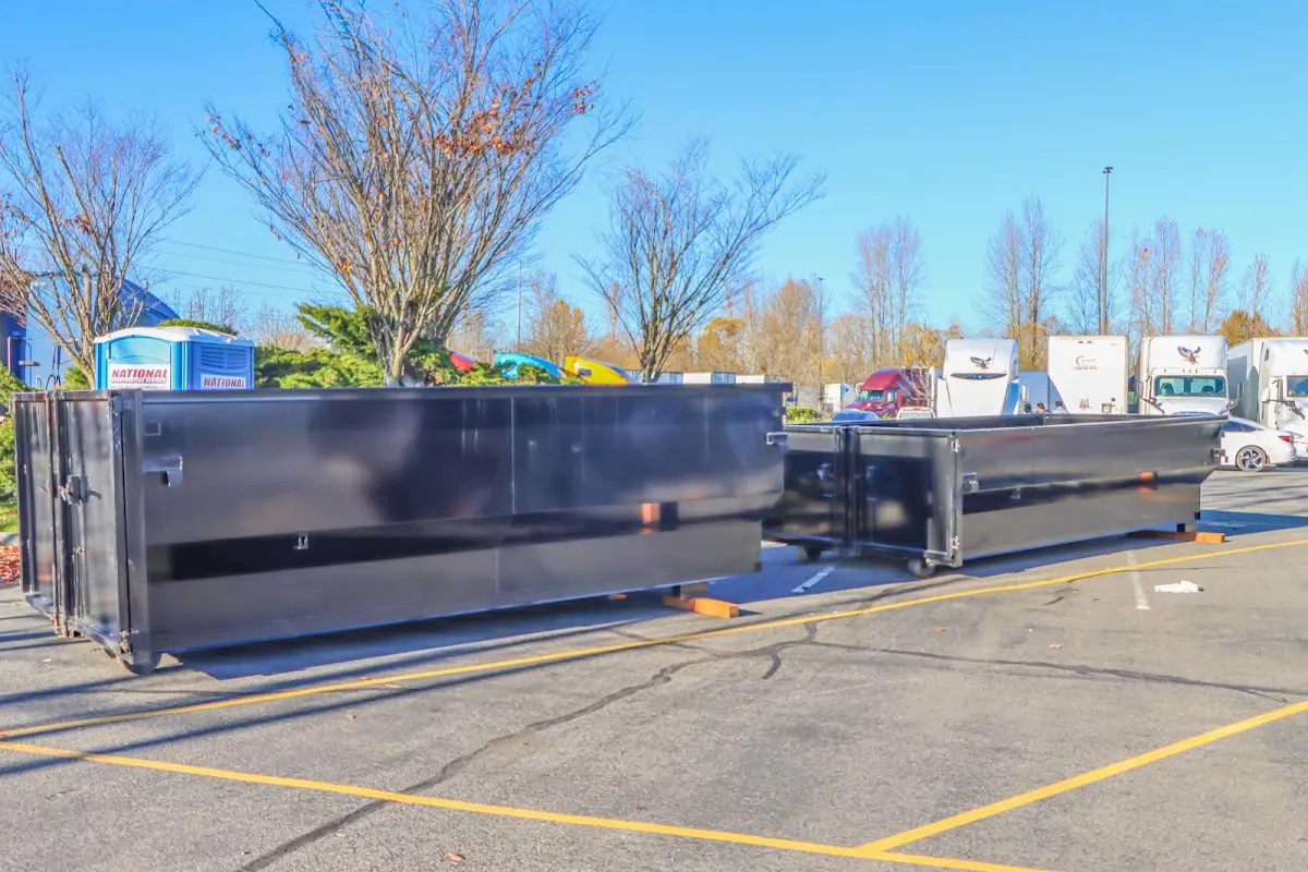 Professional dumpster rental service with roll-off container on residential driveway in Bayonet Point